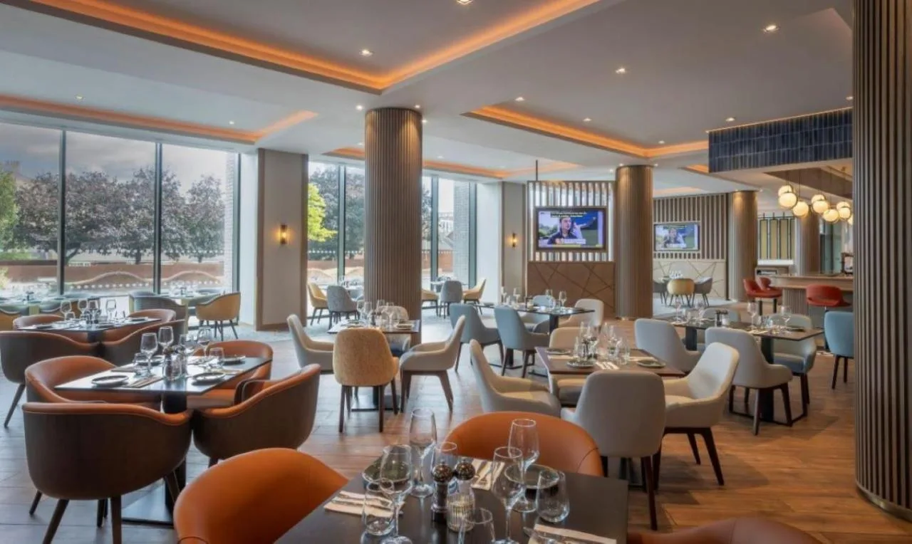 Restaurant with tables and chairs at Maldron Hotel Liverpool City Centre on Park Lane